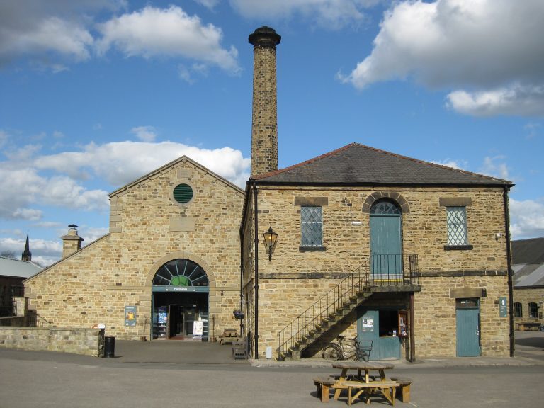 Stone workshop buildings and chimney at Elsecar Heritage Centre, Barnsley