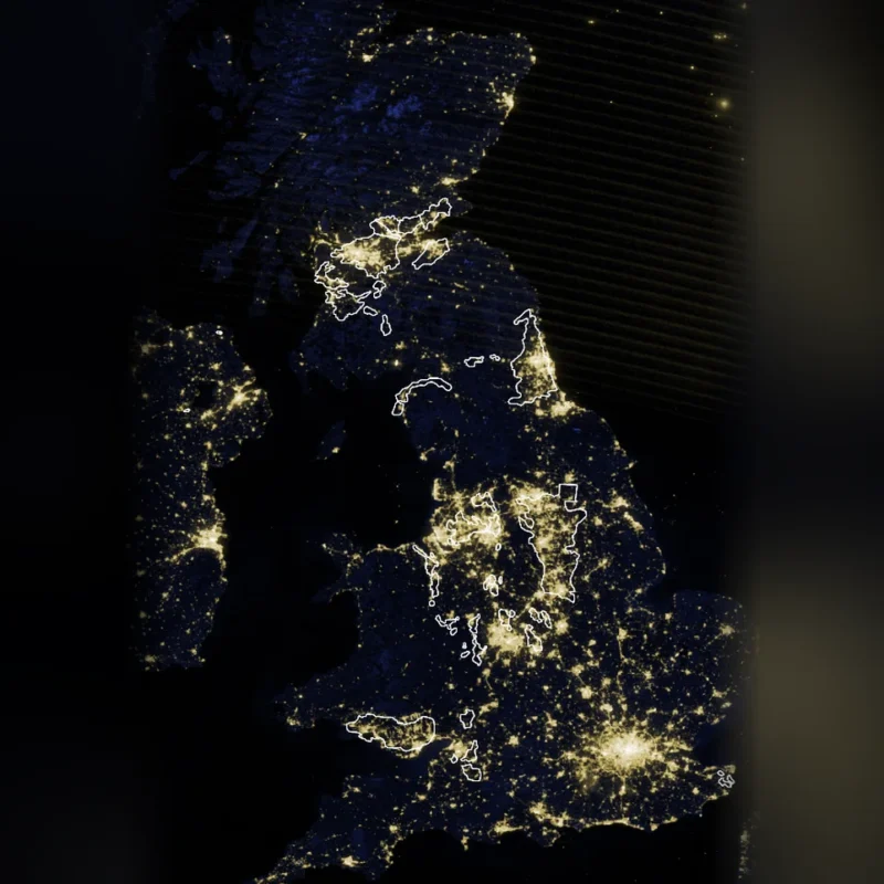 Satellite image of the UK at night with the UK coalfields outlined in white